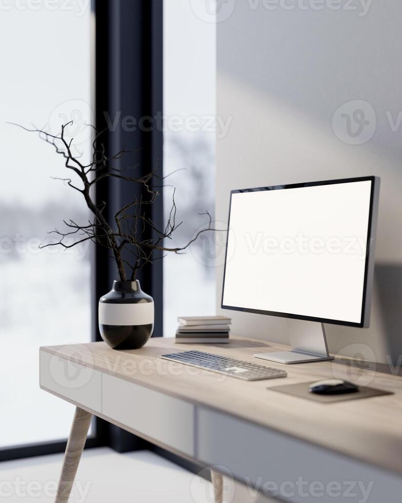 Computer and a black ceramic vase with dried branches placed on a table in a white, minimalist room. photo