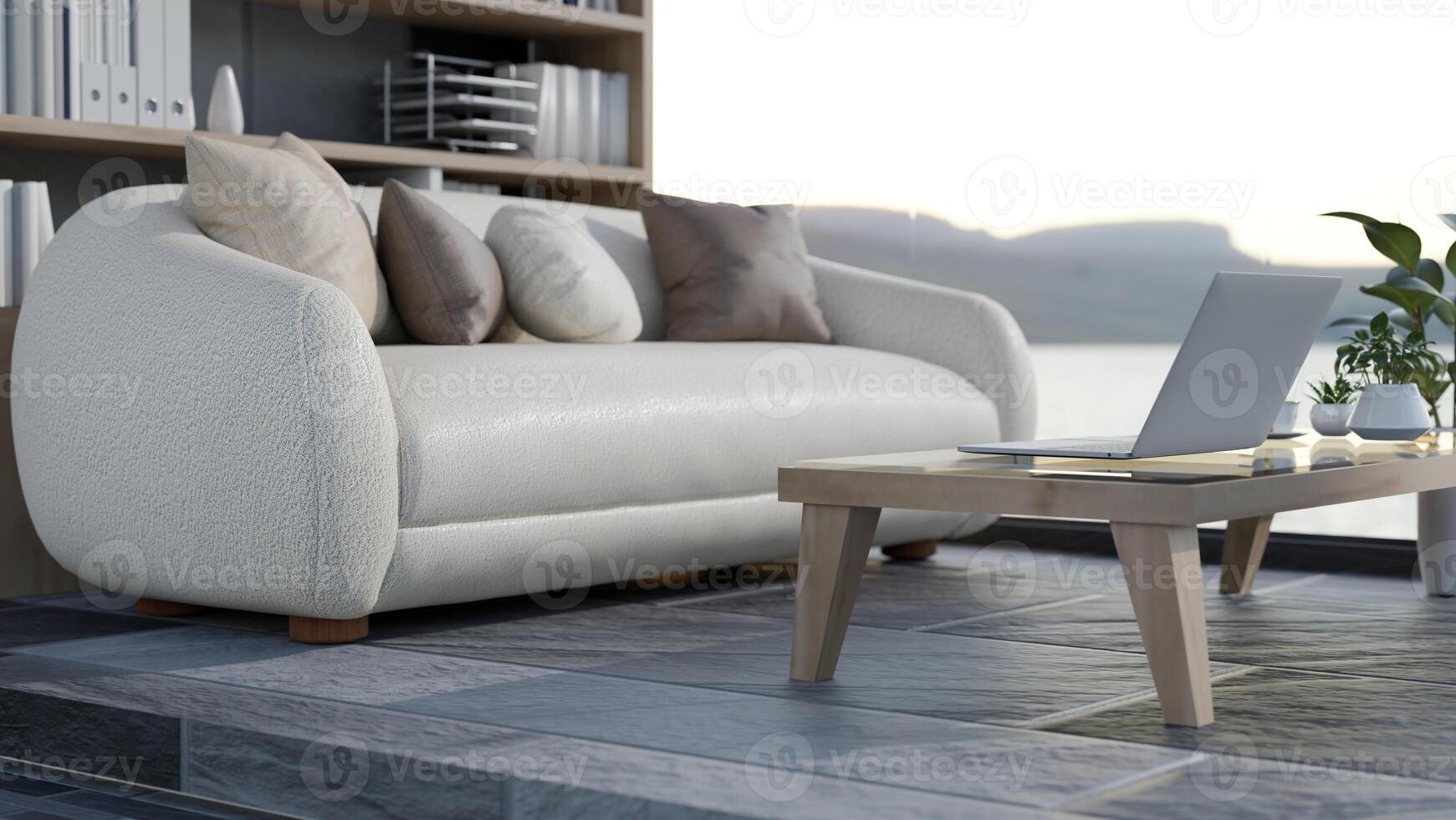 A close-up of a laptop on a coffee table in a modern office lounge. photo