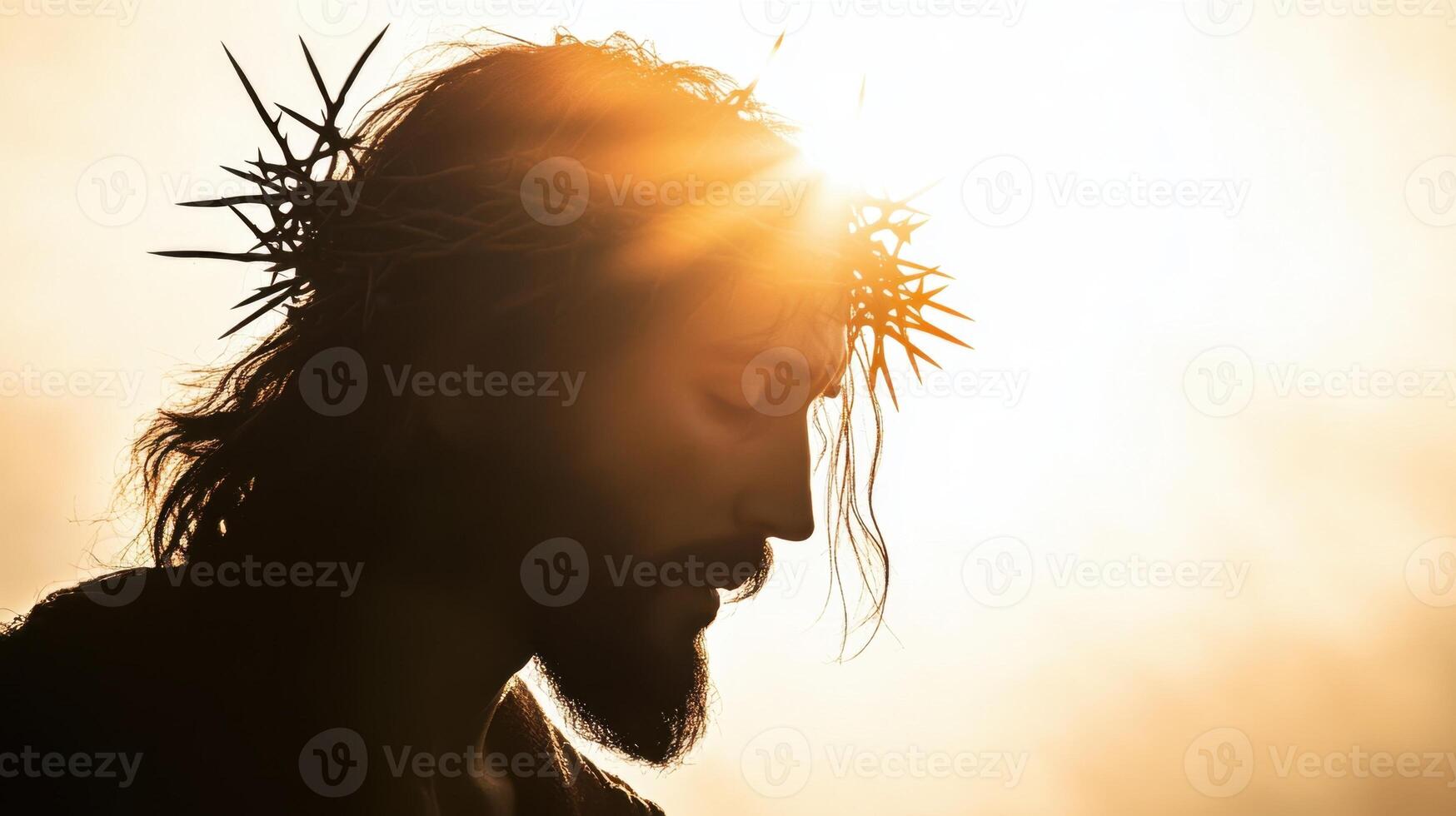 Silhouette of Jesus with a crown of thorns on his head, facing away from the camera photo
