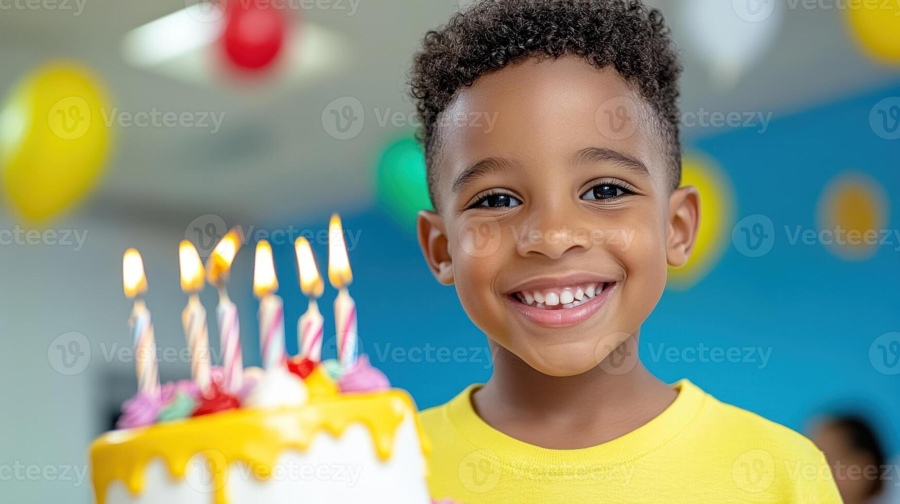 Happy and smiling African American child boy celebrates his birthday, vivid and vibrant colors photo