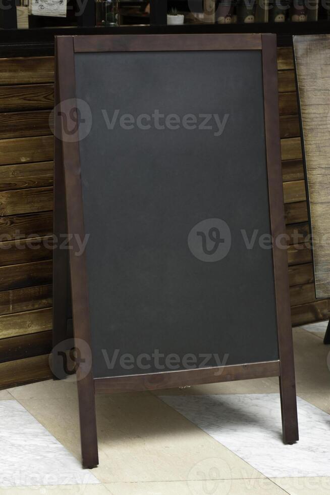 Blank black Message Blackboard in front of bar counter photo