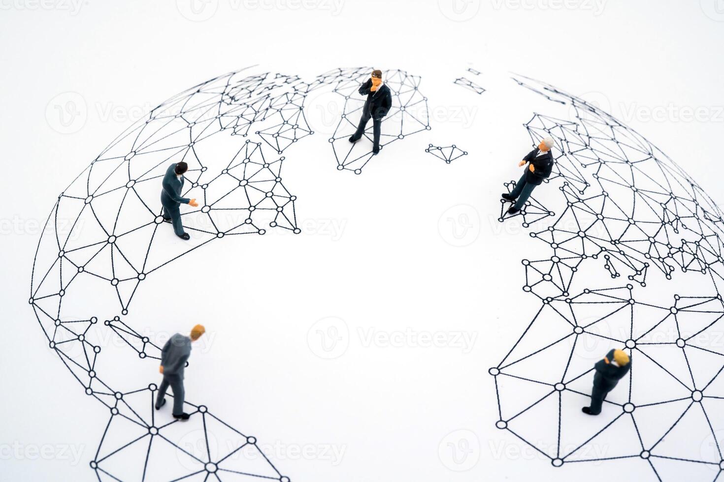 Five businessmen standing on the map of the world, meeting photo