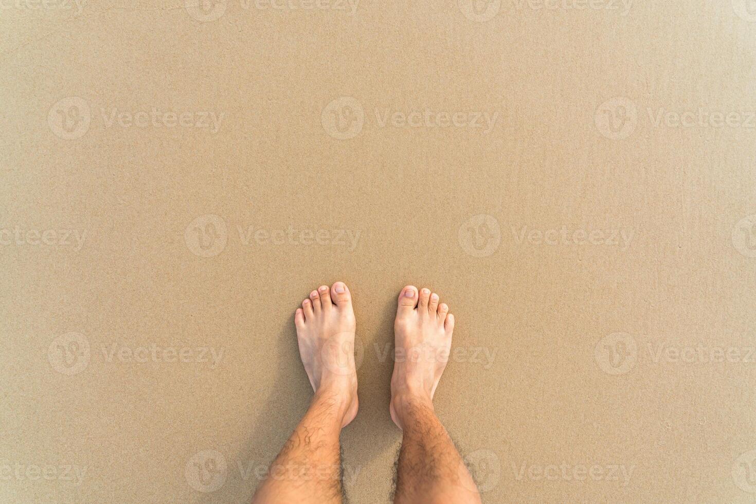 barefoot on the yellow clean beach photo