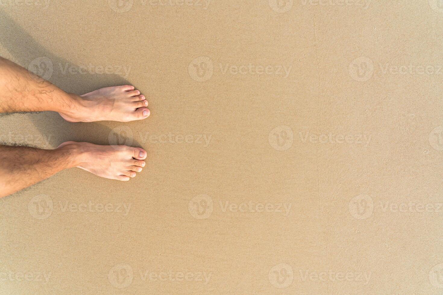 barefoot on the yellow clean beach photo