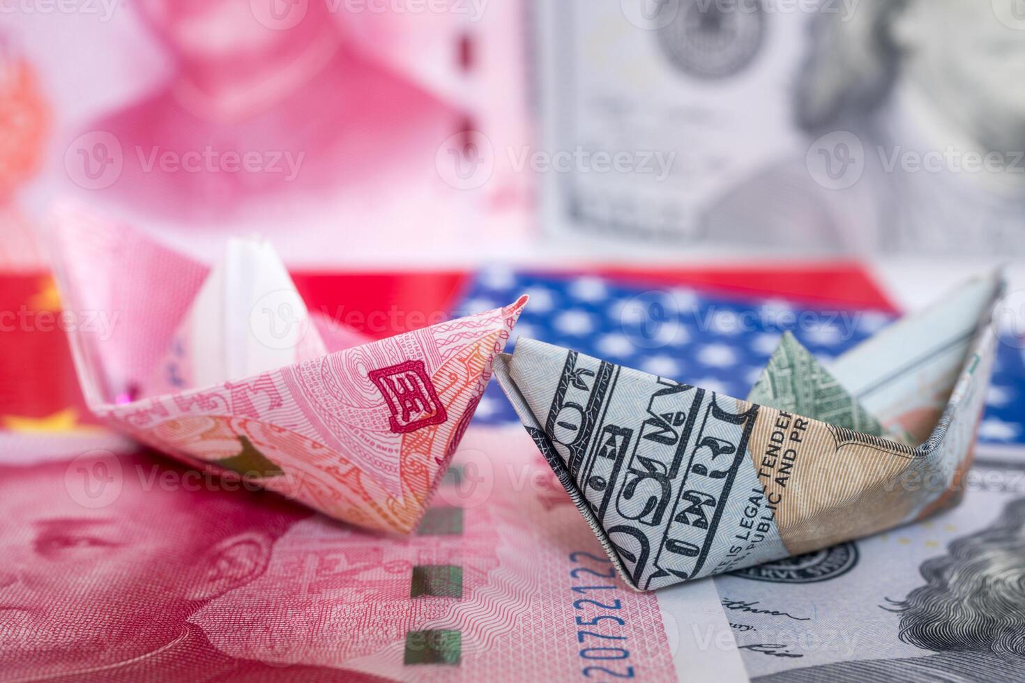 Paper folding ship of Dollar and Yuan currency photo