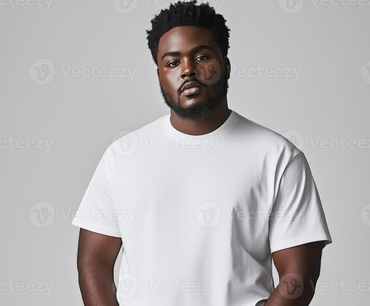 Man wearing a white t-shirt poses confidently against a neutral background photo