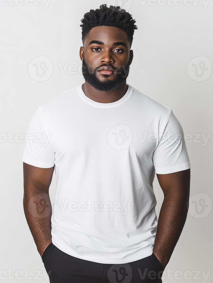 Portrait of a man in a plain white shirt with confident expression photo