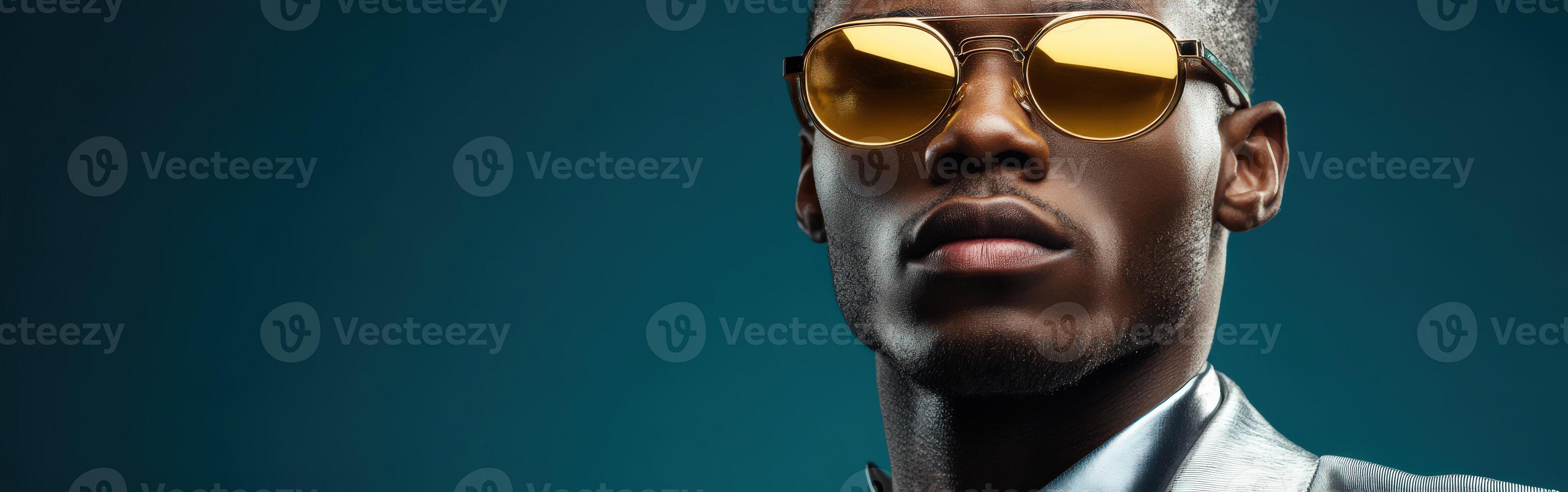 Stylish man poses with confidence against a vibrant blue background photo