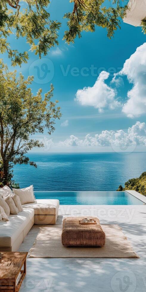 Relaxing terrace overlooking serene ocean with inviting pool on a sunny day photo