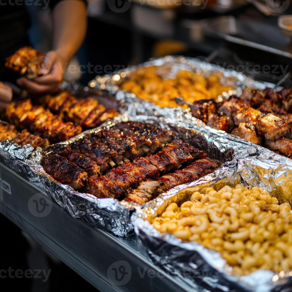 Barbecue feast with grilled meats and pasta at a street food stall photo