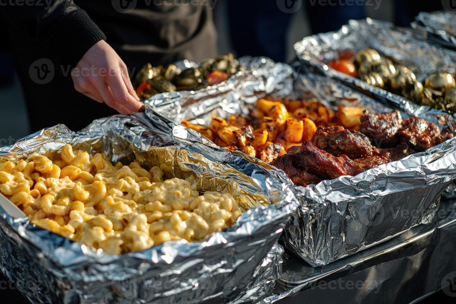 Delicious barbecue spread featuring various meats and sides at summer event photo