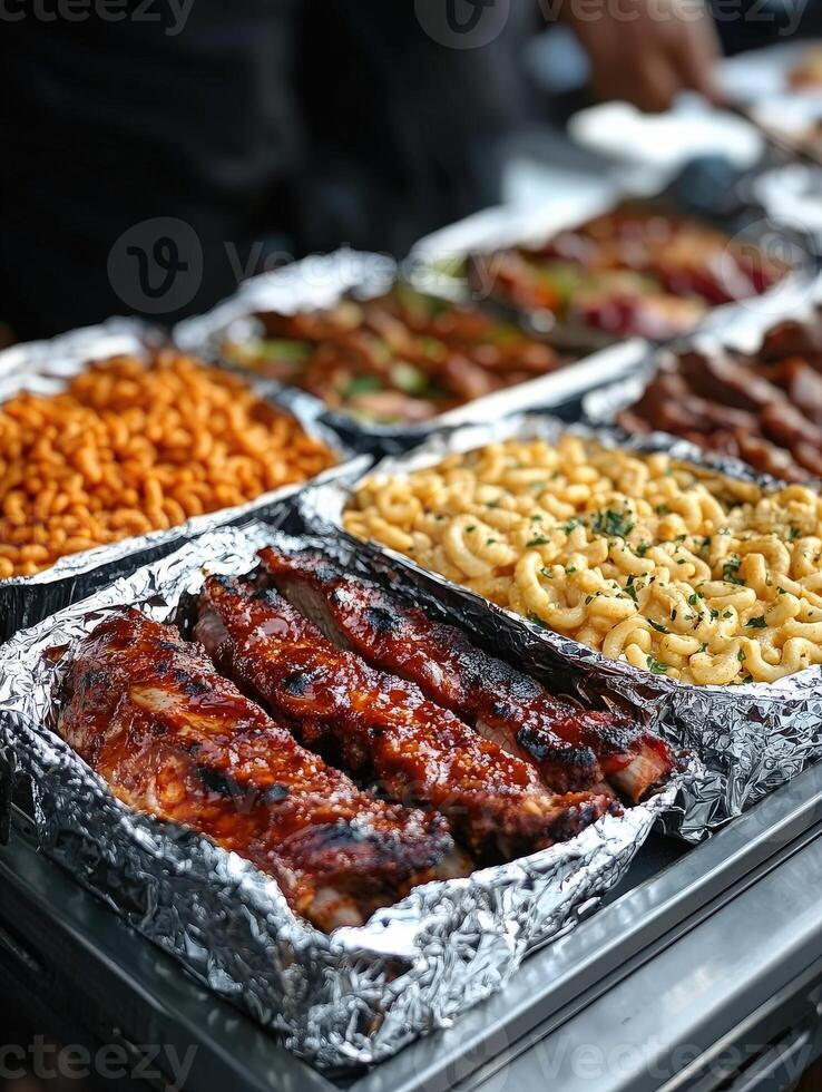 Grilled barbecue ribs with macaroni and cheese at outdoor food festival photo