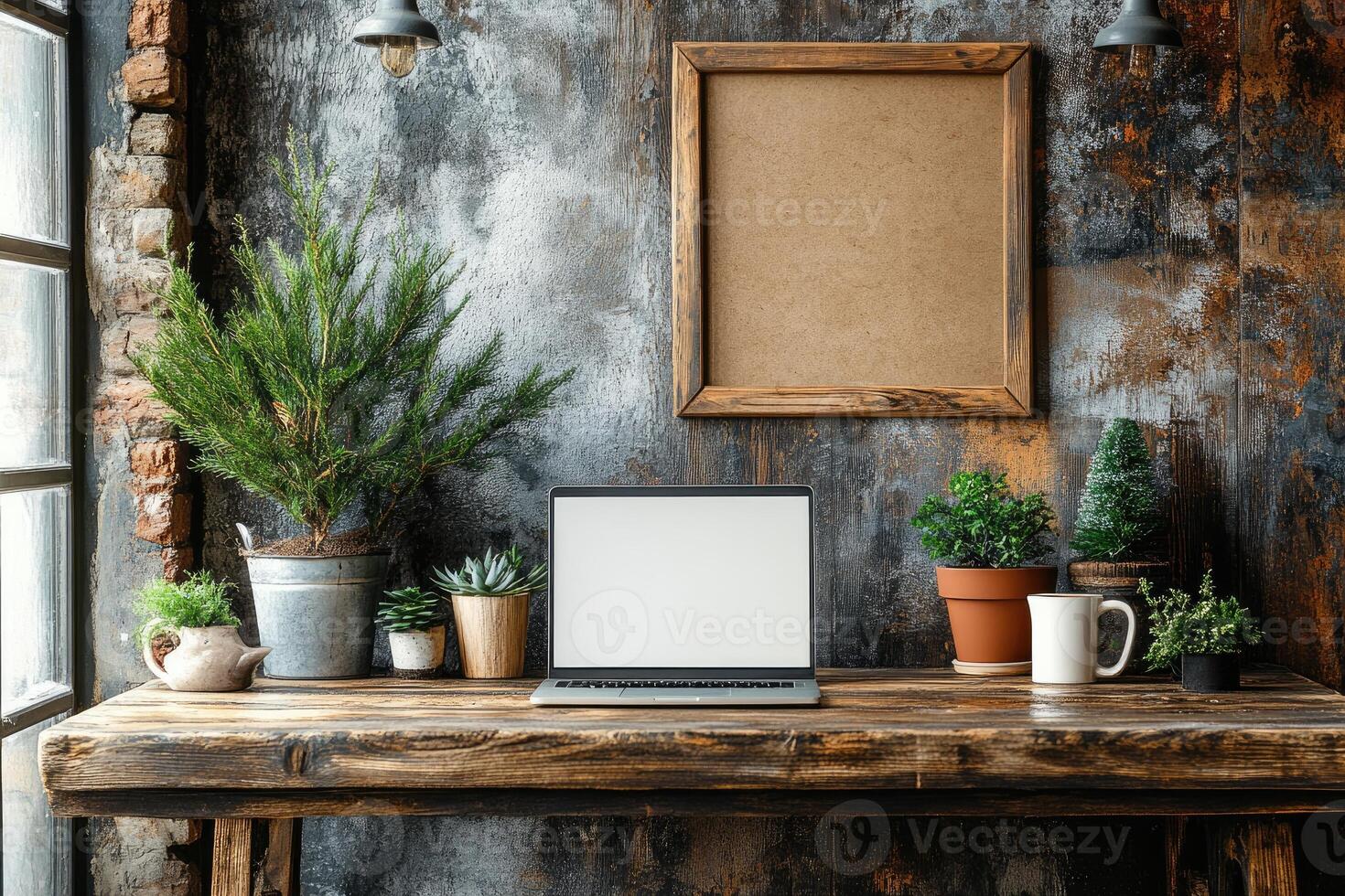 Laptop showing white screen on rustic wooden desk with plants and cork board photo