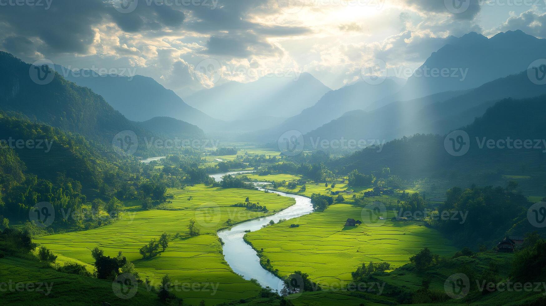 Sun rays illuminating winding river through lush green valley photo