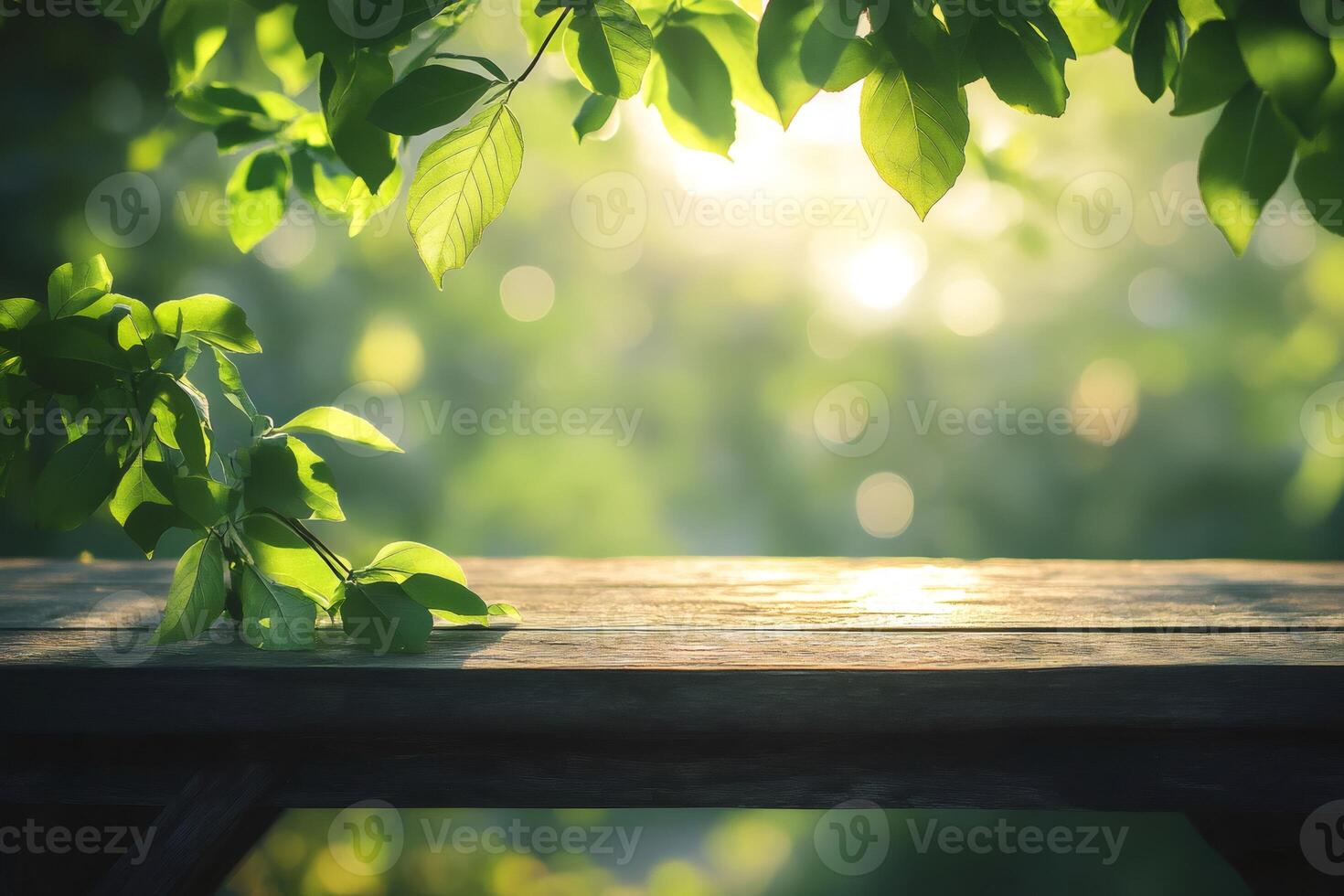Empty wooden table with green leaves and bokeh lights background for product placement photo