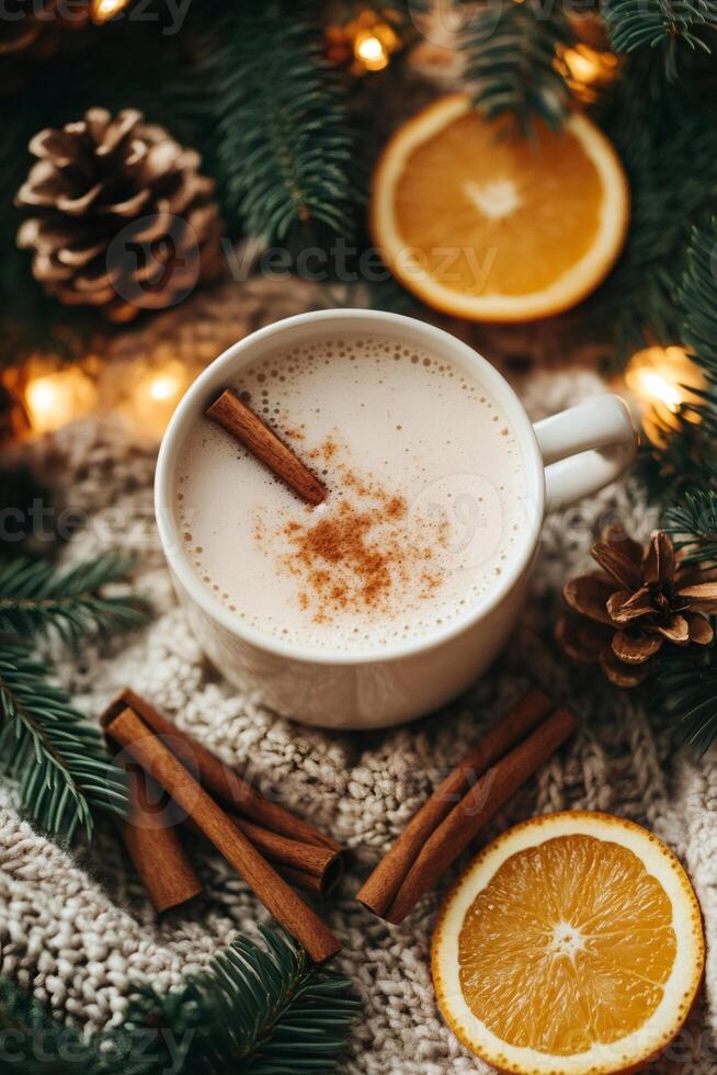 Cozy winter eggnog with cinnamon, orange slices, pine cones and string lights creating festive atmosphere photo