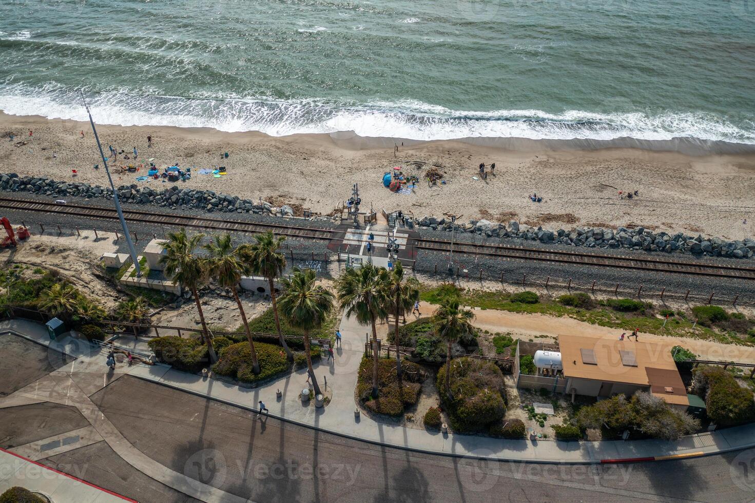 Railroad at coastline in San Clemente, California from above with stunning drone views of the beach and ocean photo
