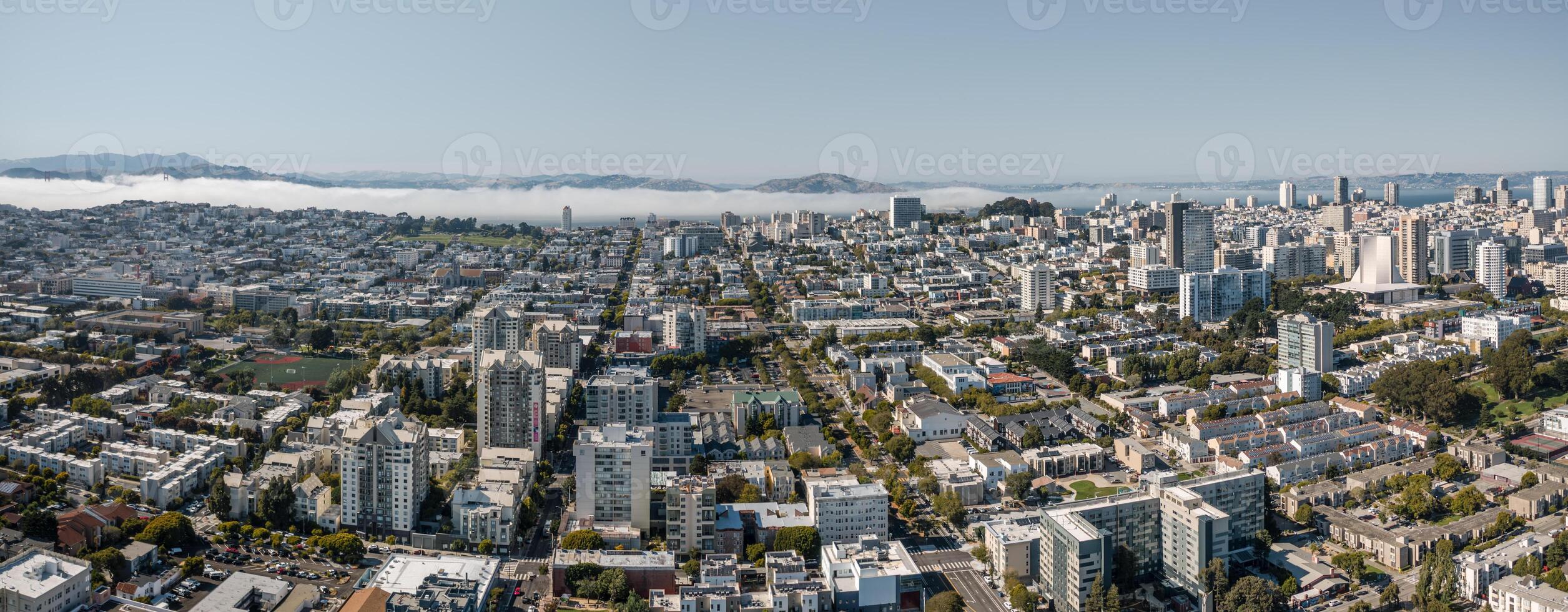 Panoramic aerial view of San Francisco showcasing cityscape and iconic architecture under clear skies photo