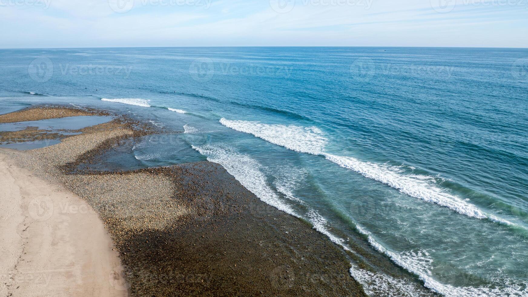 Coastal view of Trestles in San Clemente, showcasing waves and shoreline from a drone perspective photo