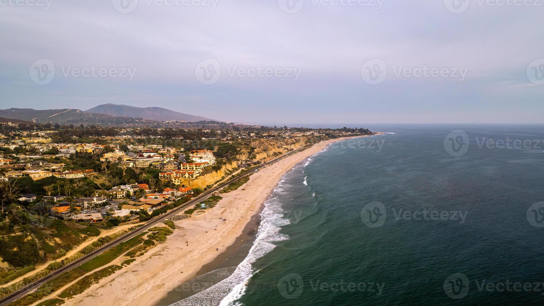 Coastal view of San Clemente, California with drone capturing the beach and ocean landscape at dusk photo