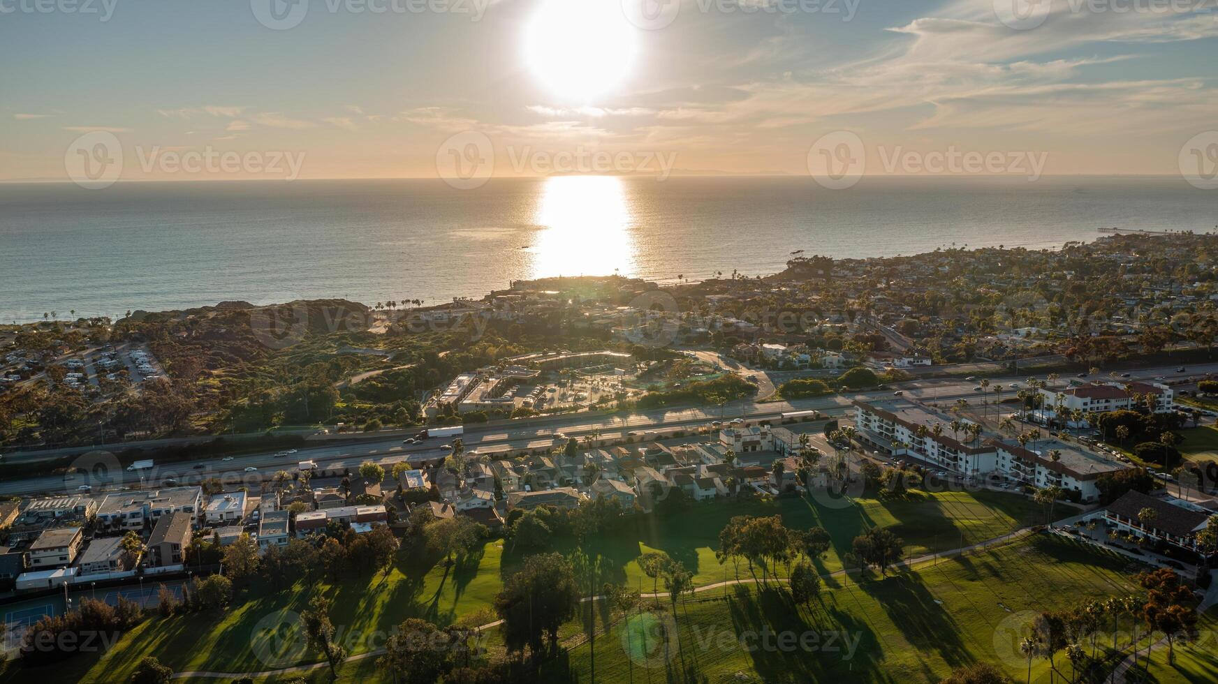 Aerial view of San Clemente California coast at sunset with sparkling ocean and scenic landscape photo