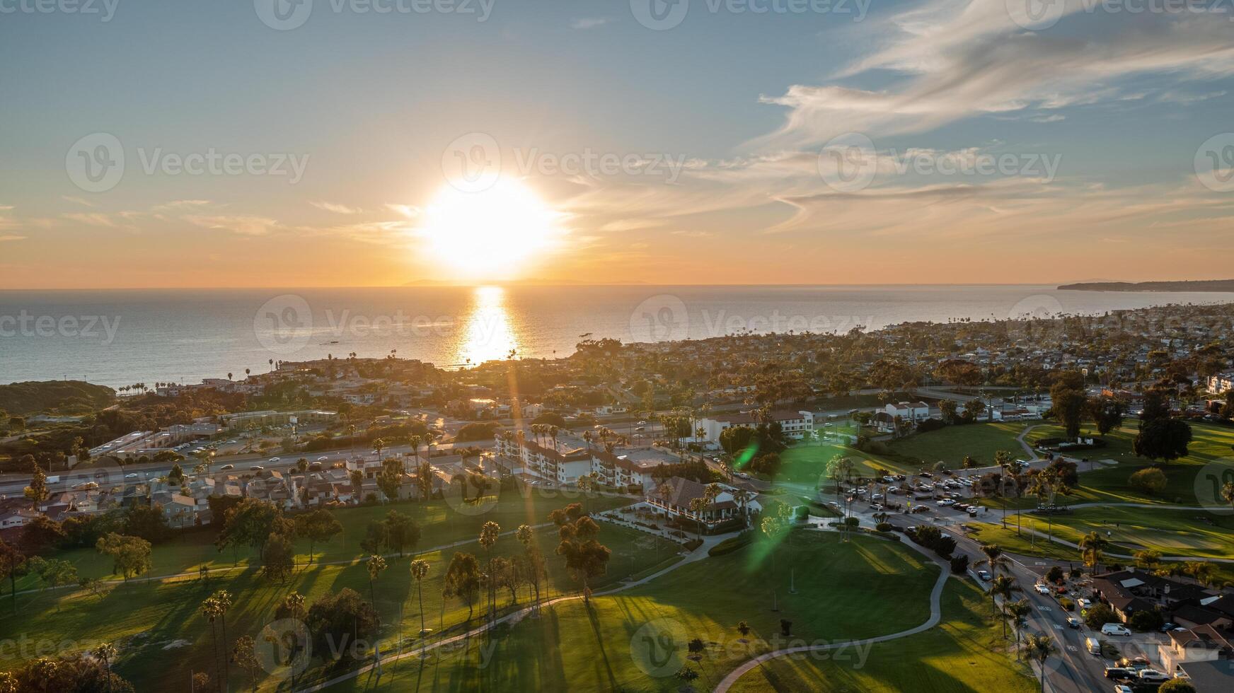 Breathtaking aerial view of the San Clemente coastline at sunset showcasing vibrant colors and serene ocean waves photo