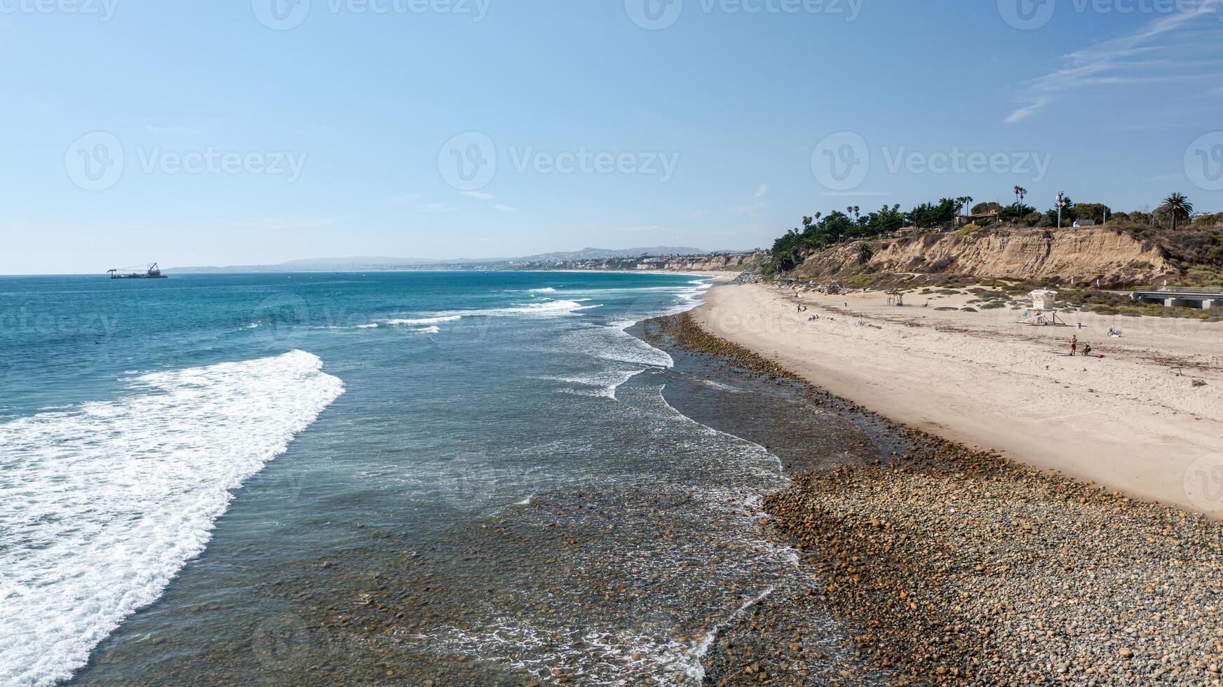 Coastal view of Trestles in San Clemente California showcasing the serene Trestles beach and clear ocean waters photo