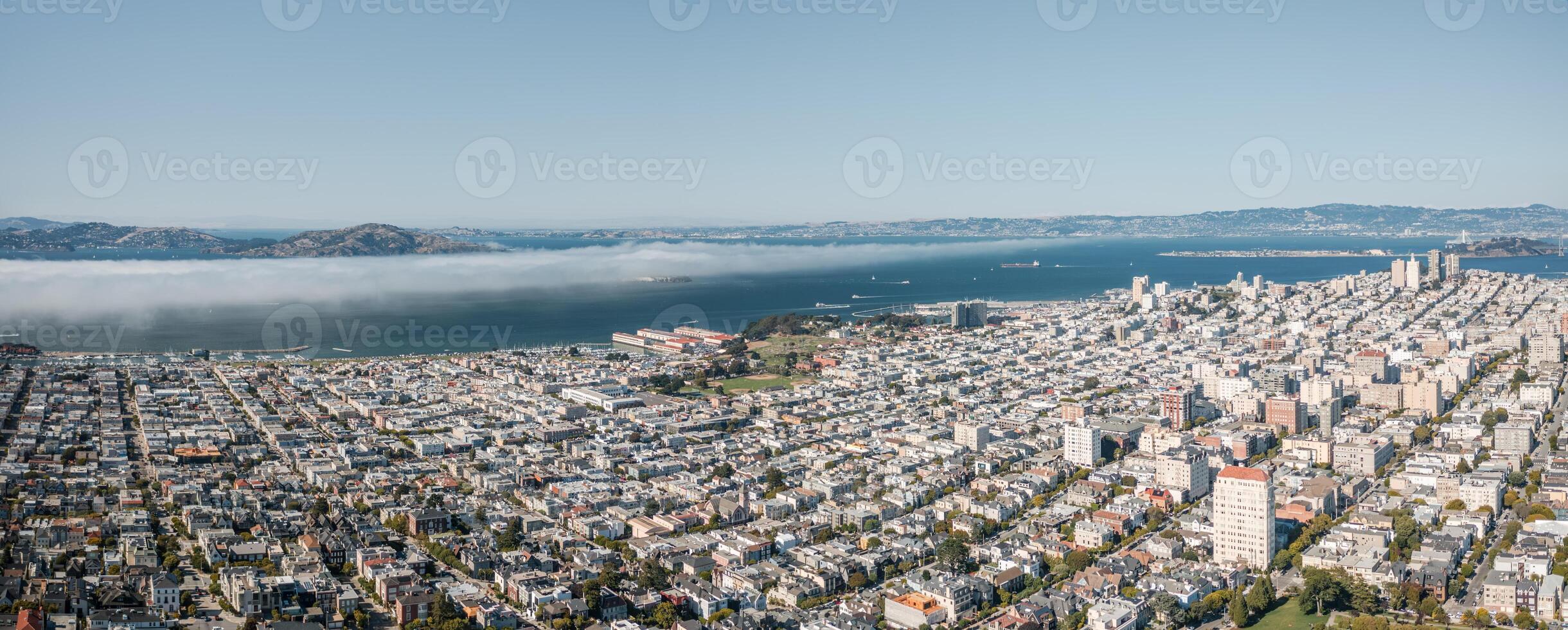Panoramic aerial view of San Francisco showcasing cityscape and waterfront under clear skies with Karl, the fog photo