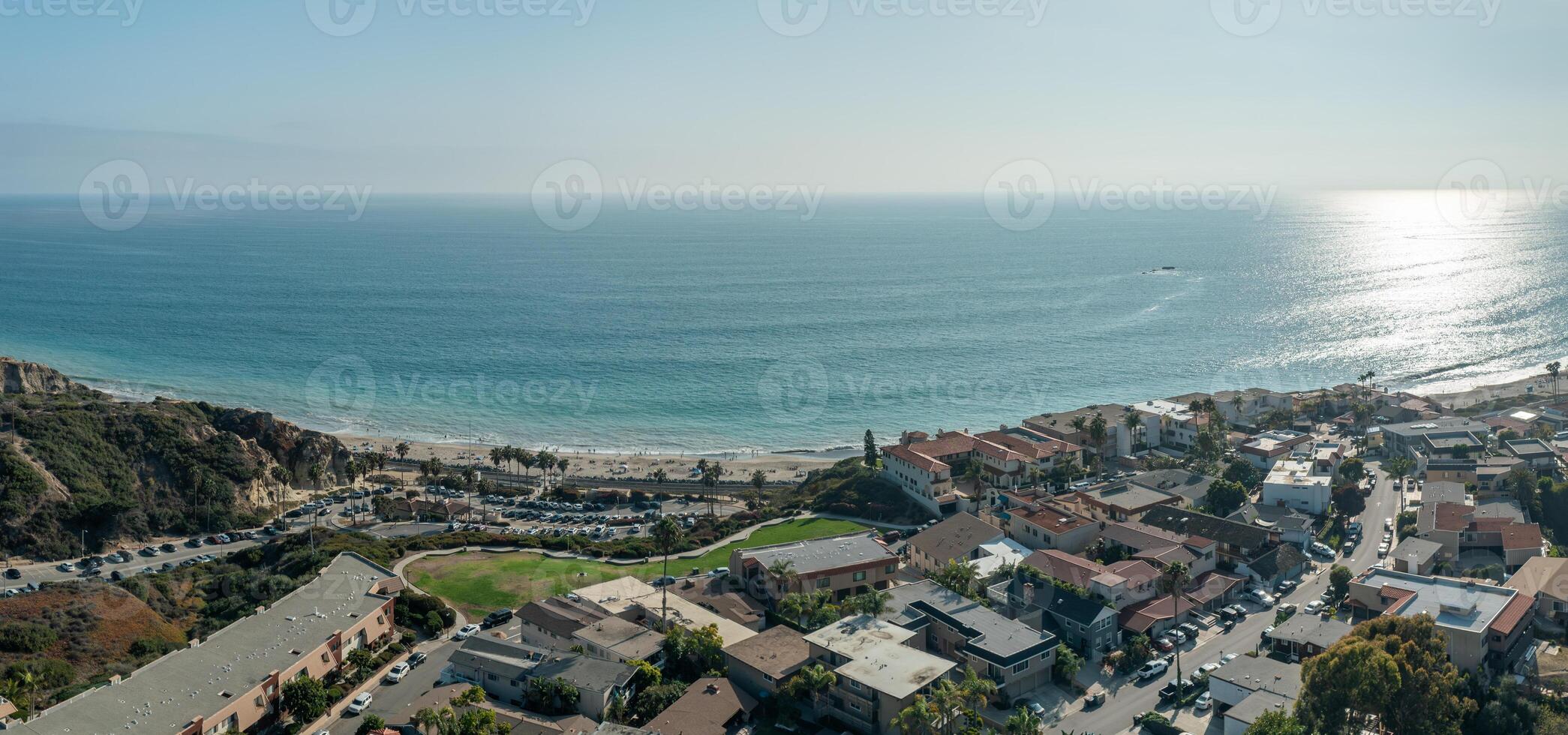 Panoramic aerial views of San Clemente coastline showcasing vibrant ocean, and sandy beach over The Loop photo