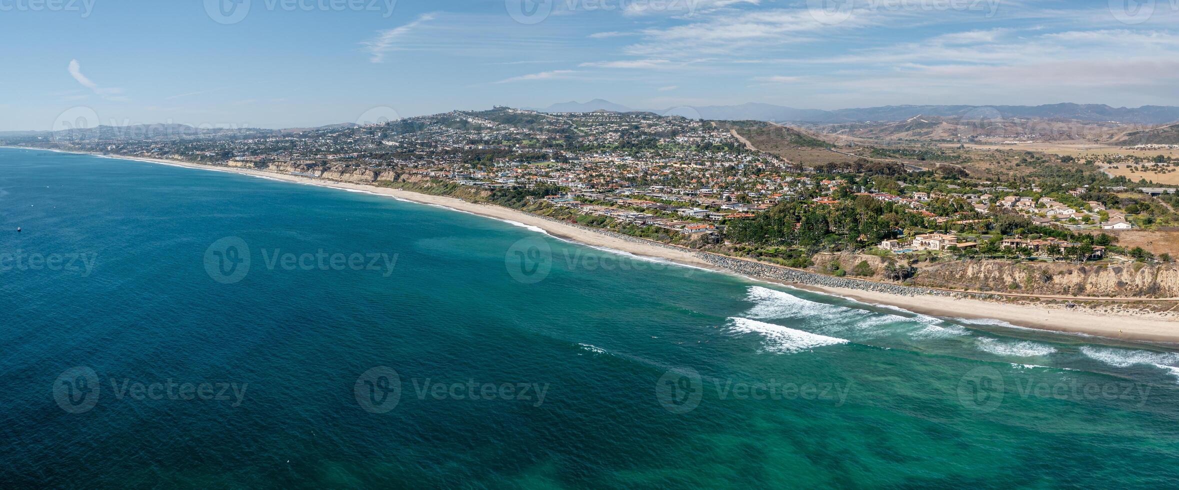 Panoramic aerial view of San Clemente coastline showcasing pristine beaches and vibrant ocean waves photo