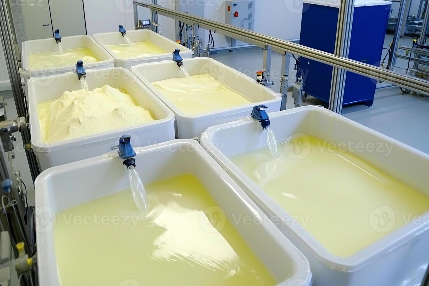 A factory with several containers filled with milk photo