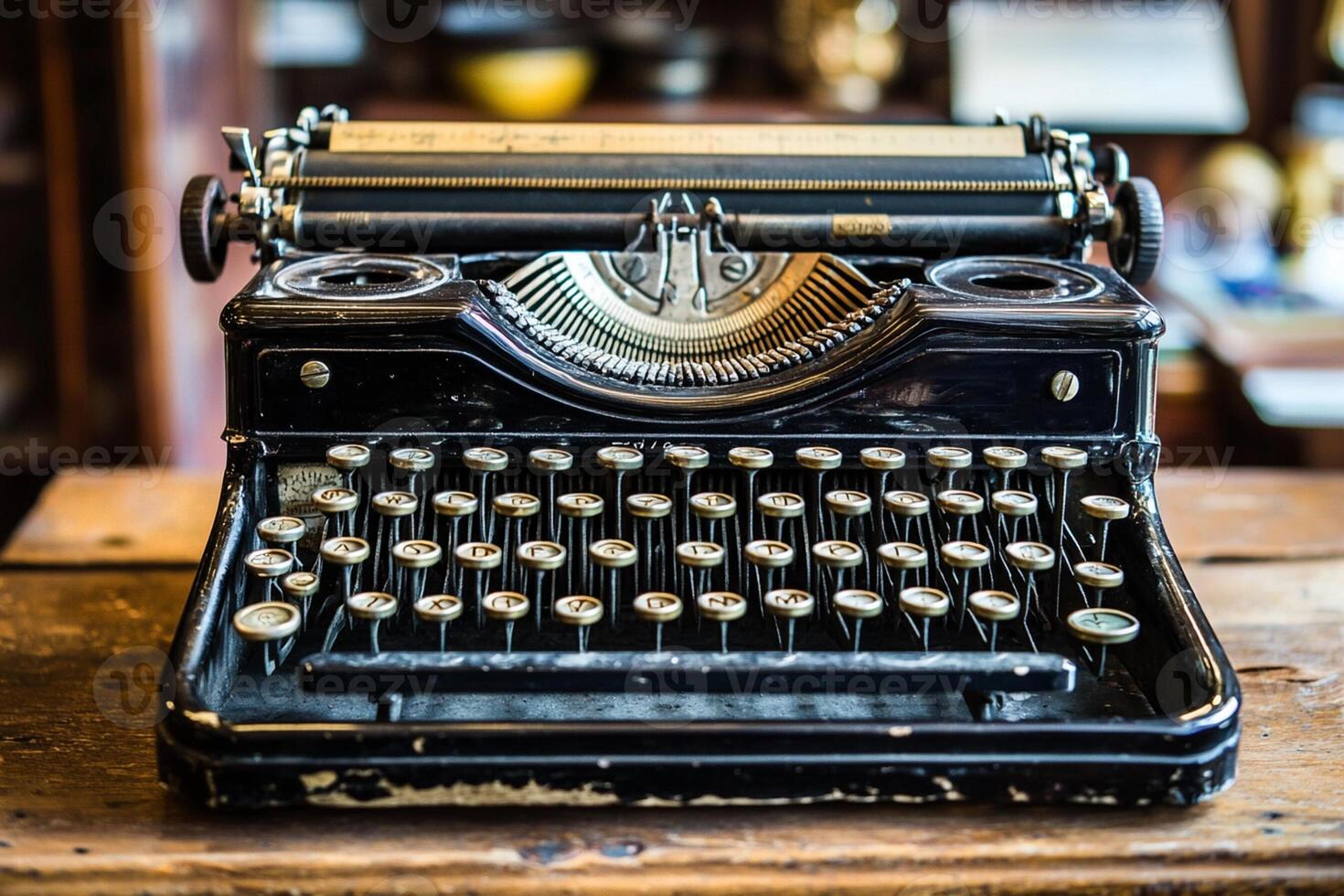 An old fashioned typewriter sitting on a wooden table photo