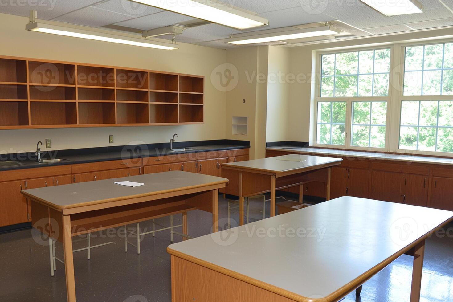 A classroom with desks and a window photo