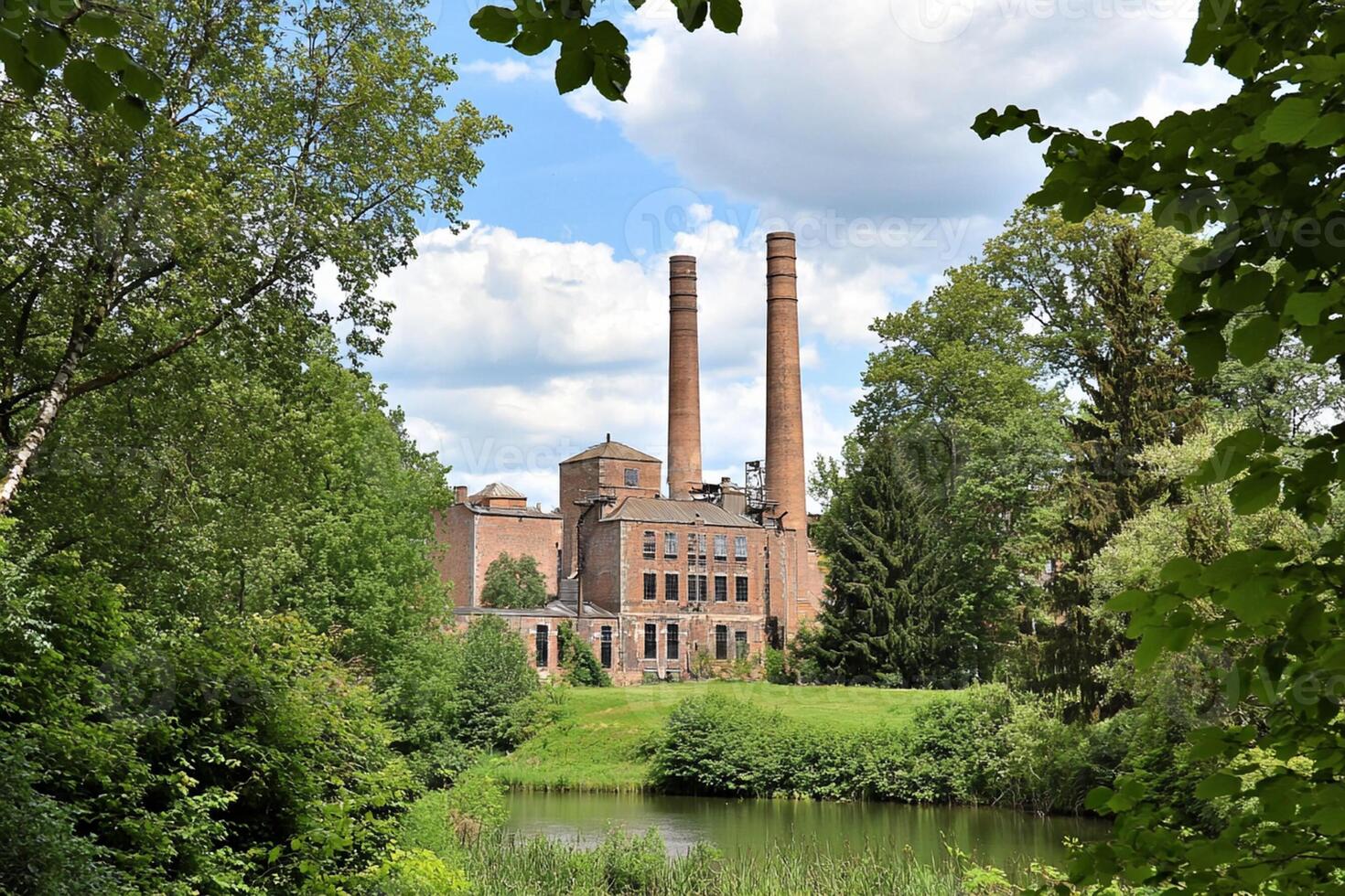 A large brick building with two chimneys photo