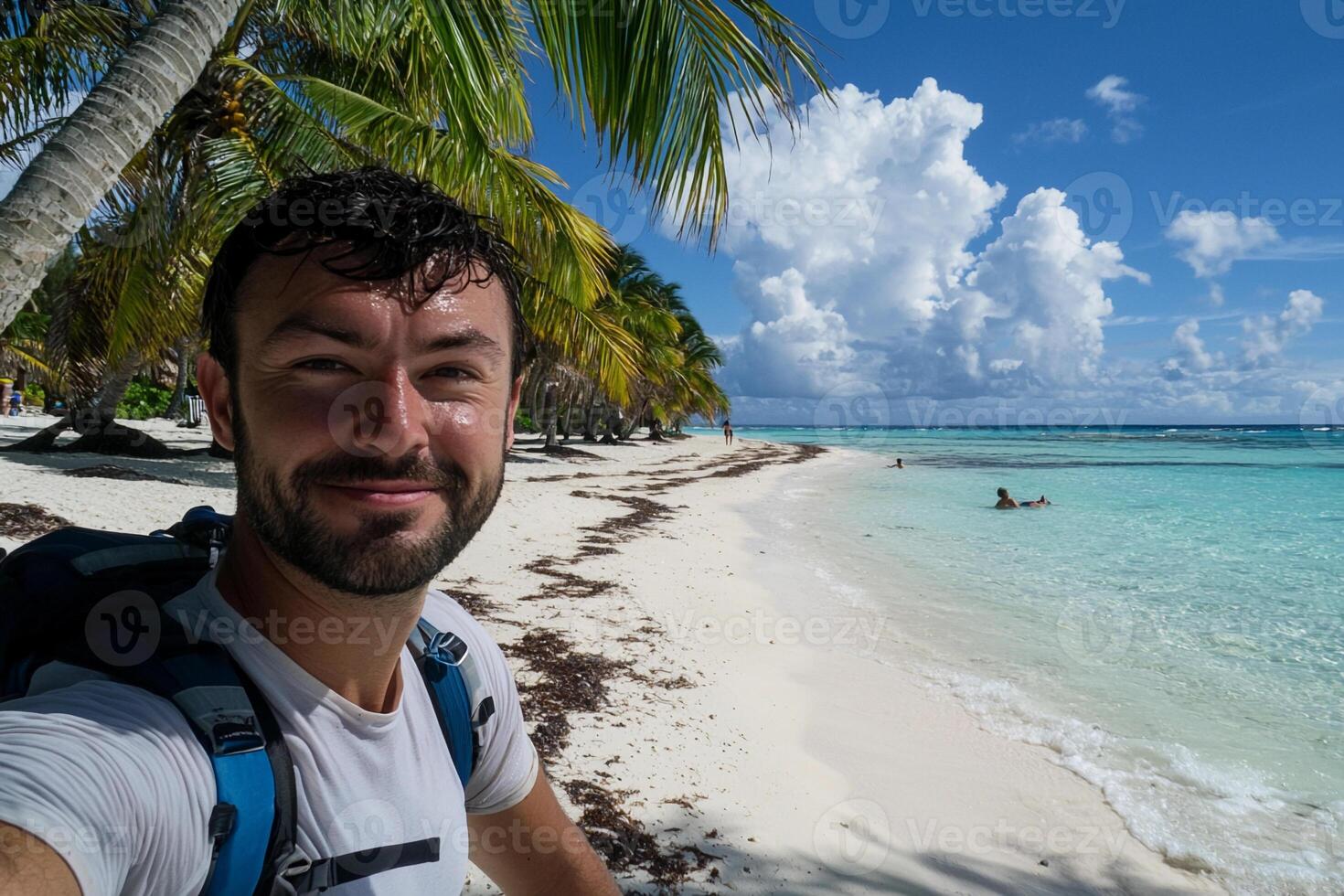 A man taking a selfie on the beach photo