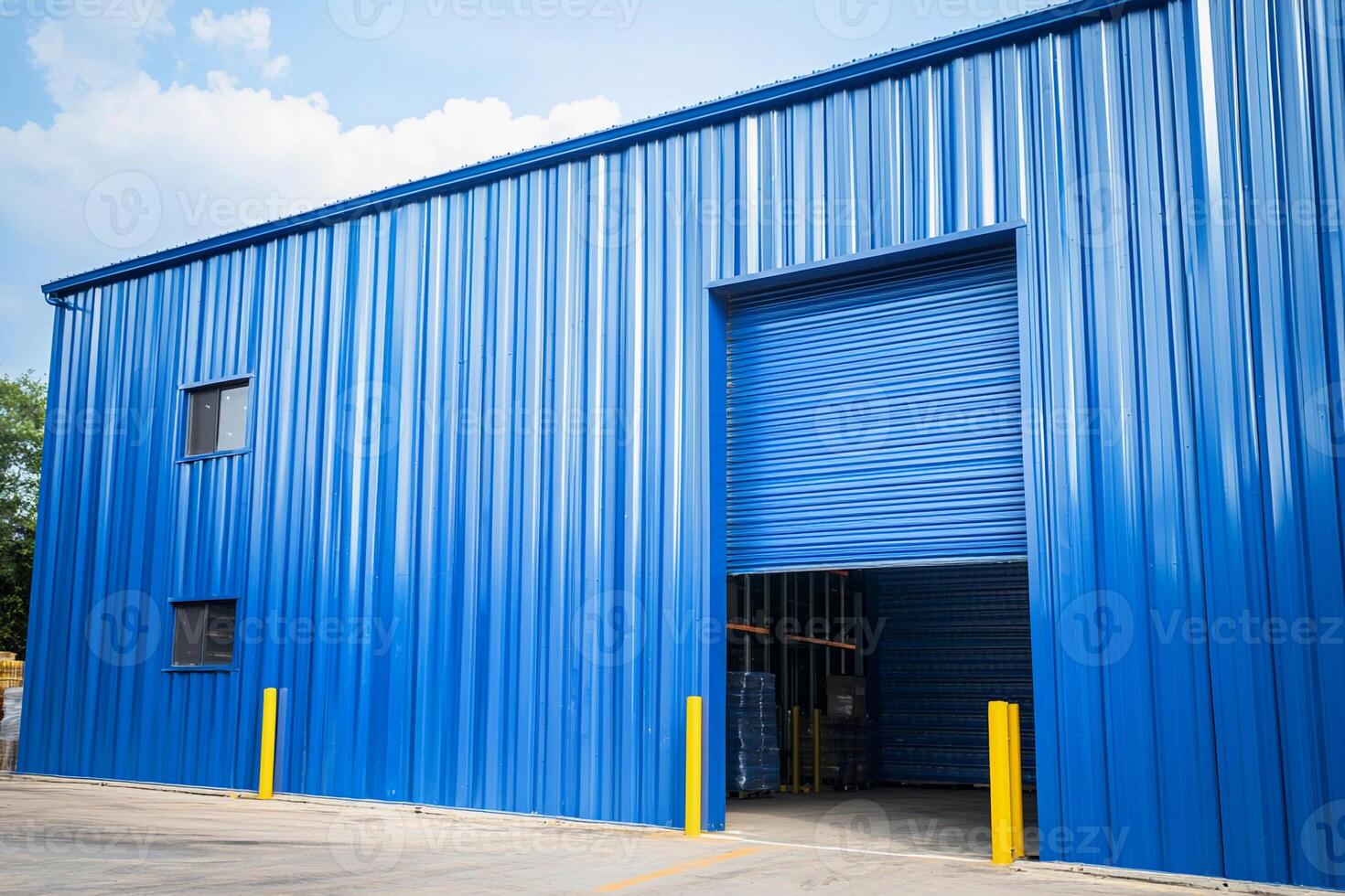 A blue building with a garage door open photo