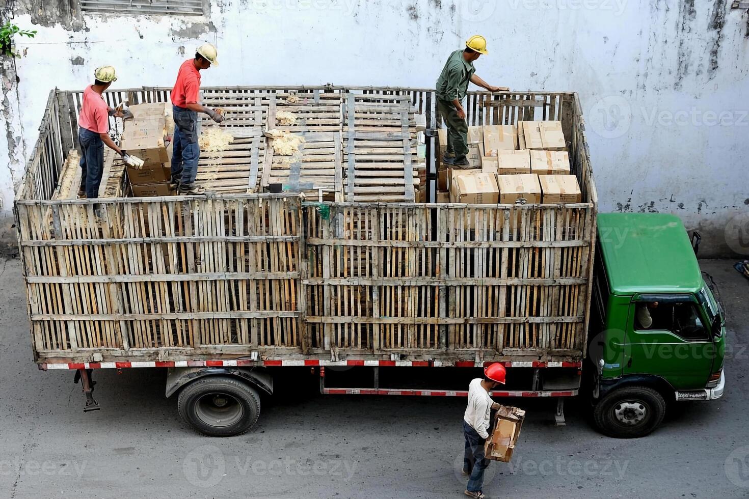 Workers load pallets onto a truck in ho chi minh city, vietnam, on photo
