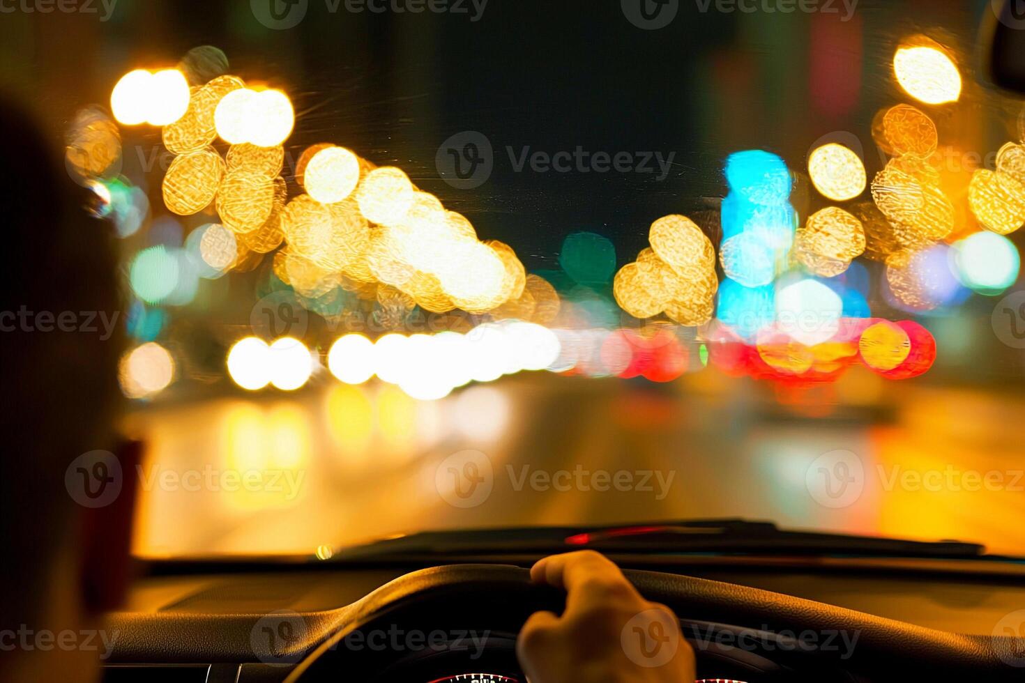 A man driving a car at night photo