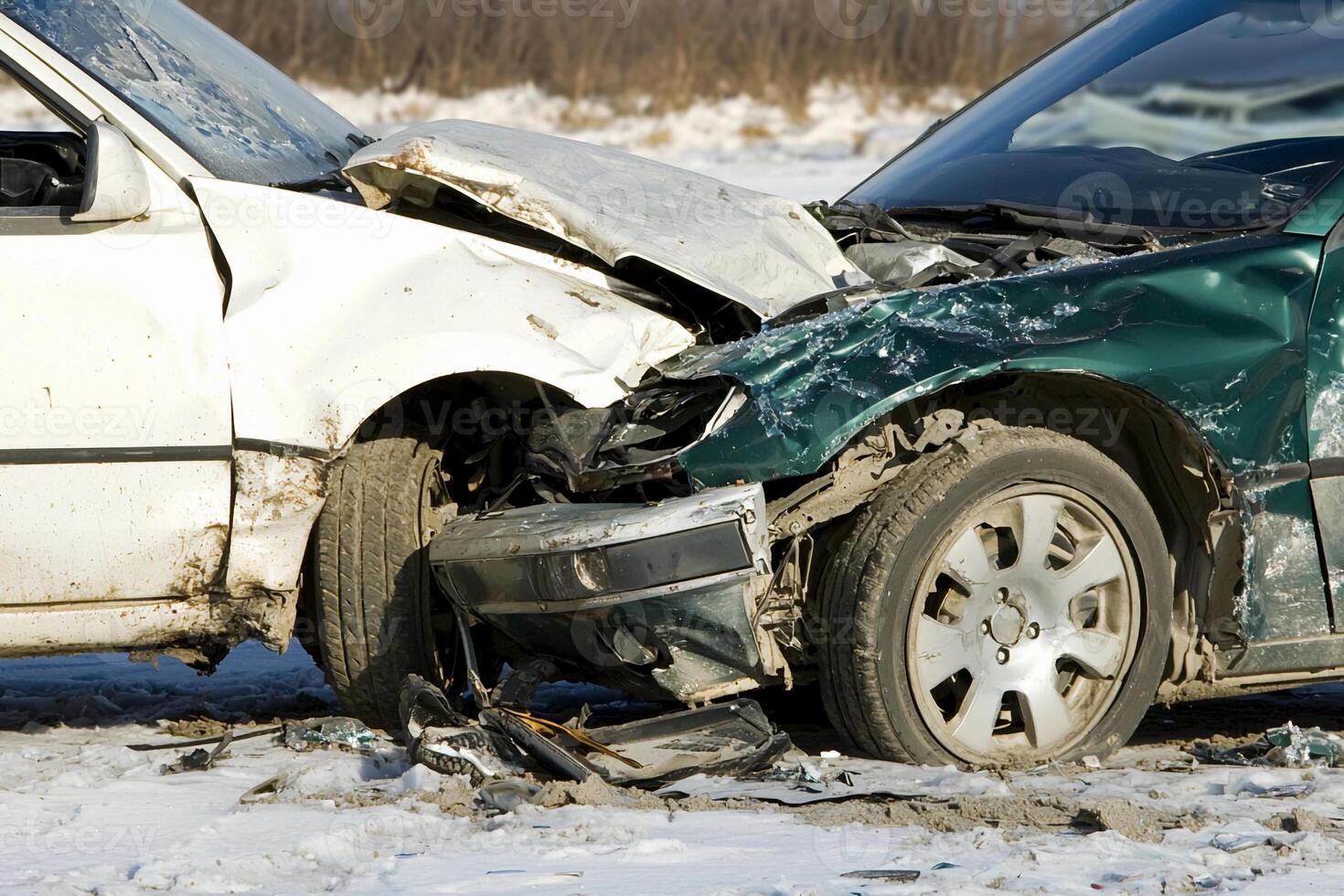 Two cars that have been damaged in a snow storm photo