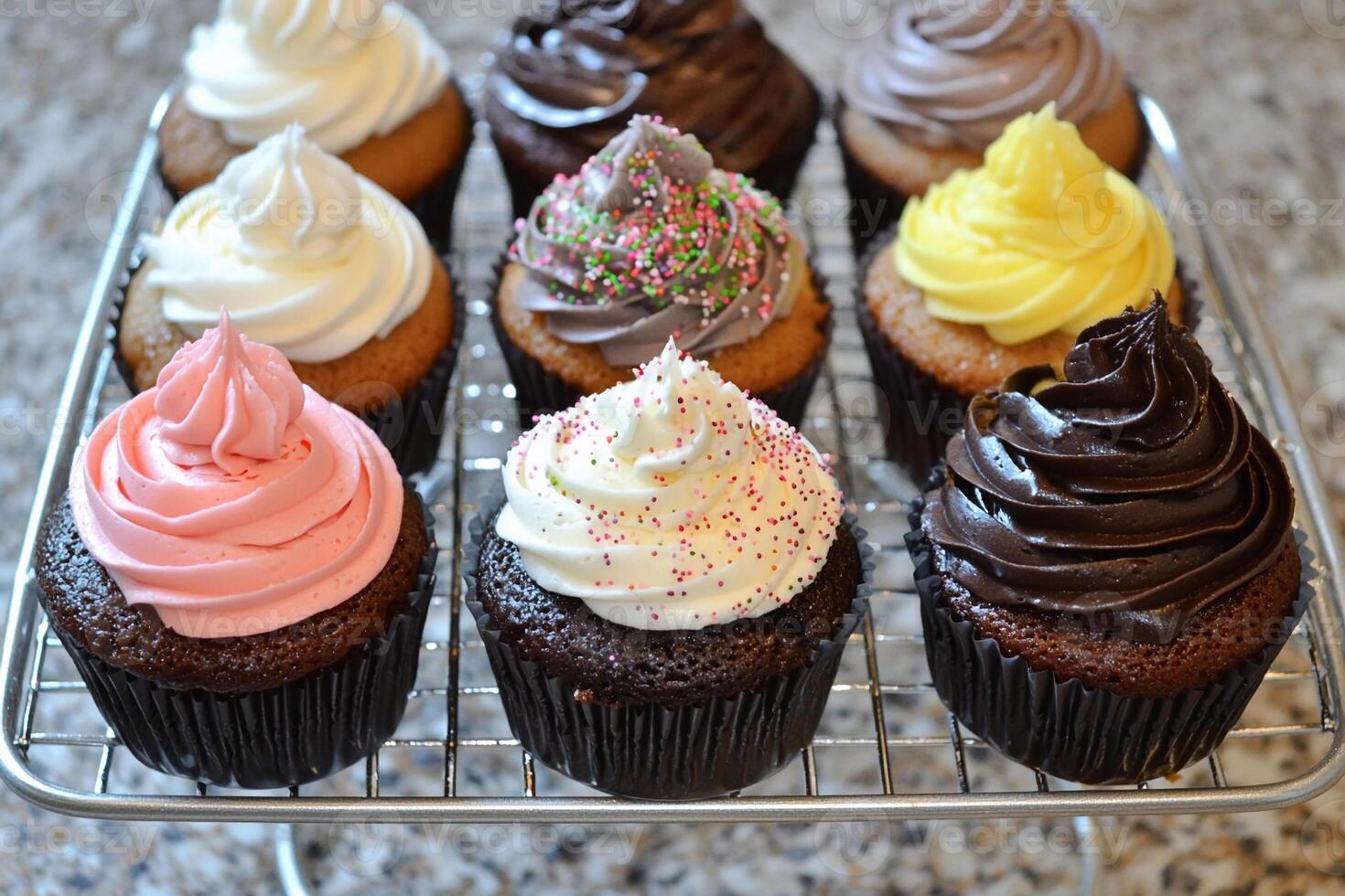 A rack of cupcakes with different flavors photo