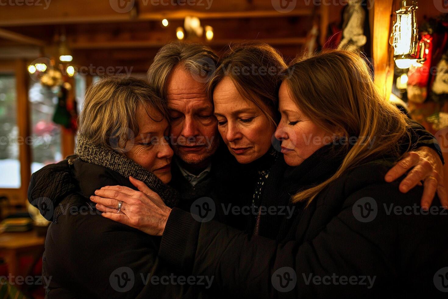 Three women are hugging each other in a room photo