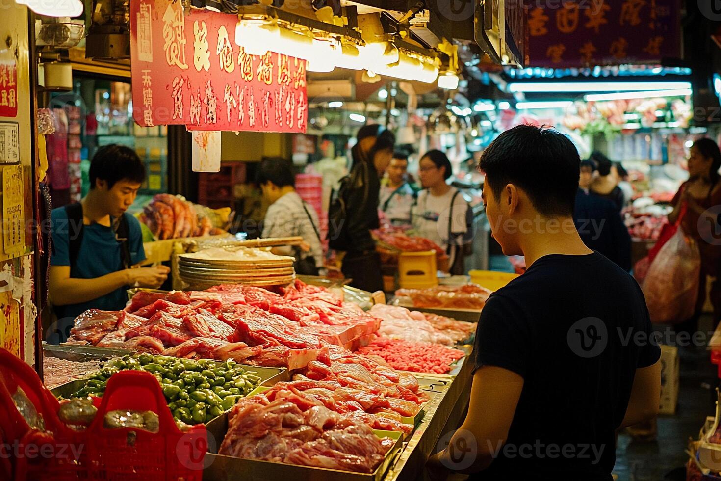 A man standing in front of a market with meat on display photo