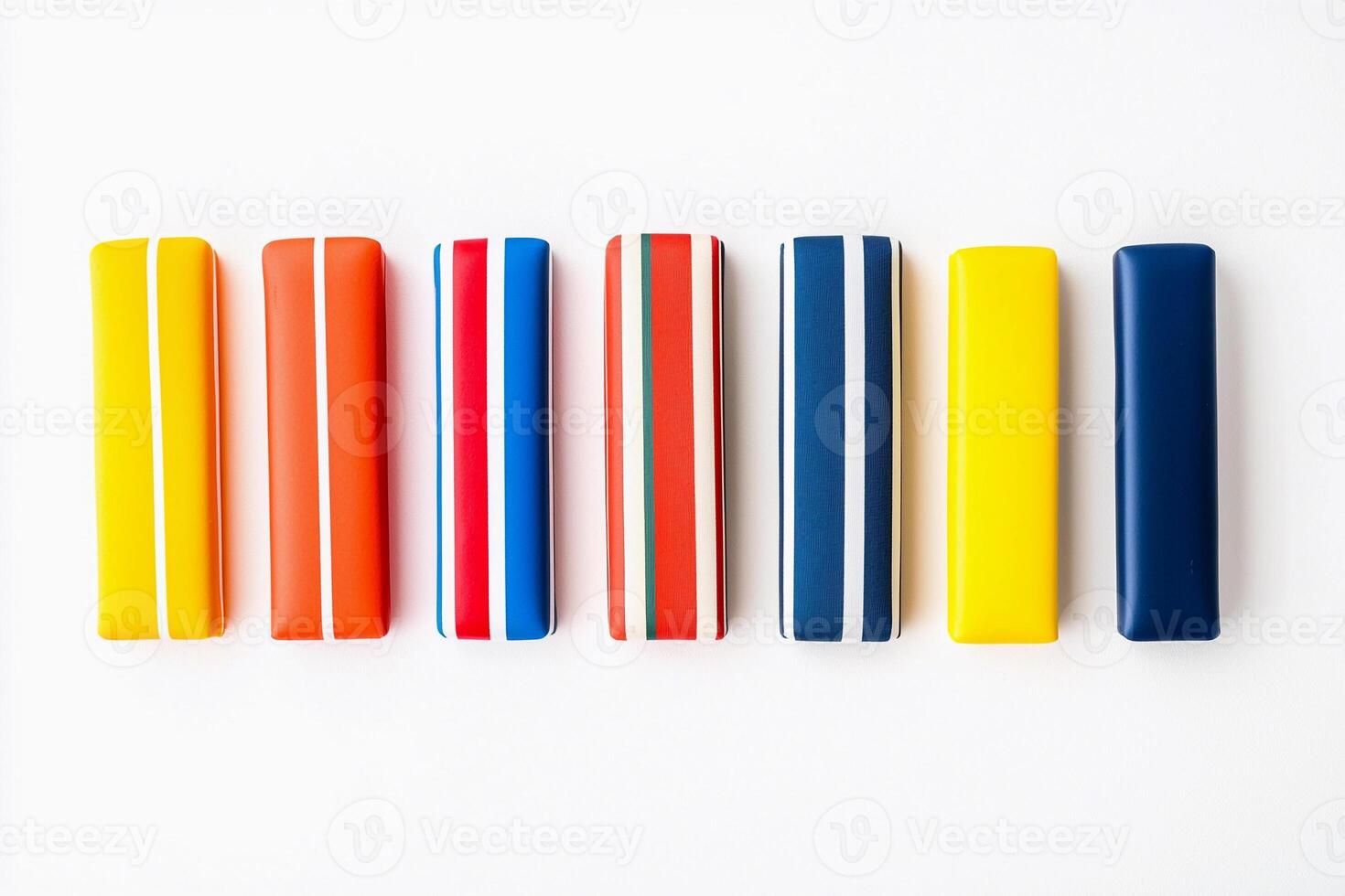 A row of colorful pencils on a white surface photo