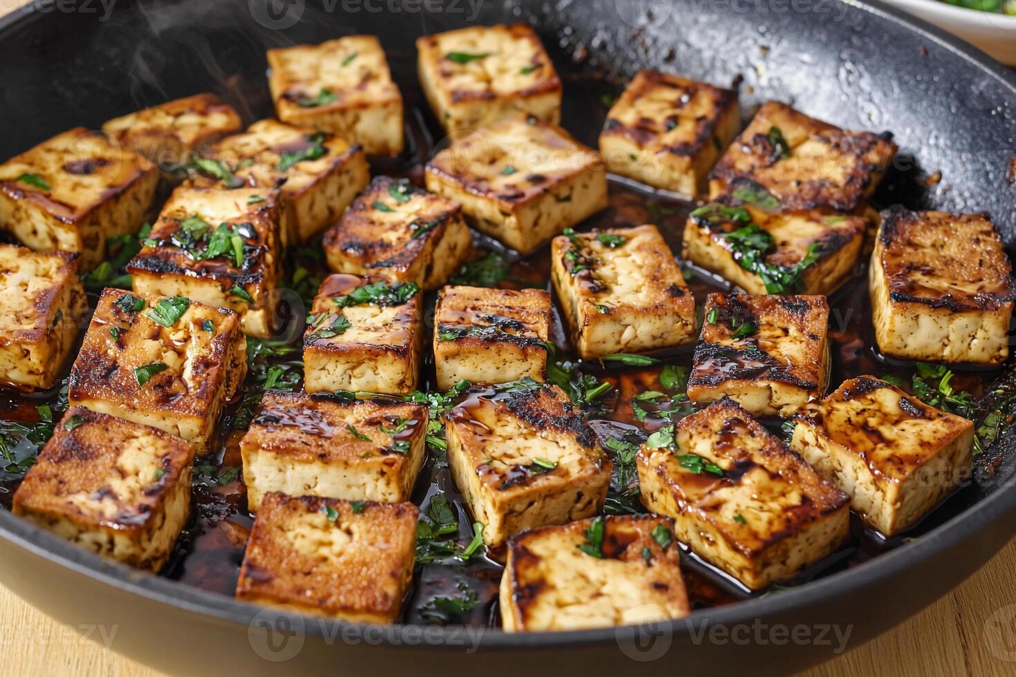 A pan filled with tofu and herbs photo