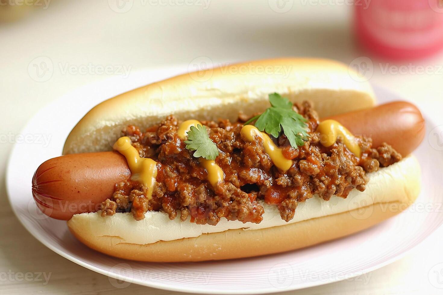 A chili dog on a plate photo