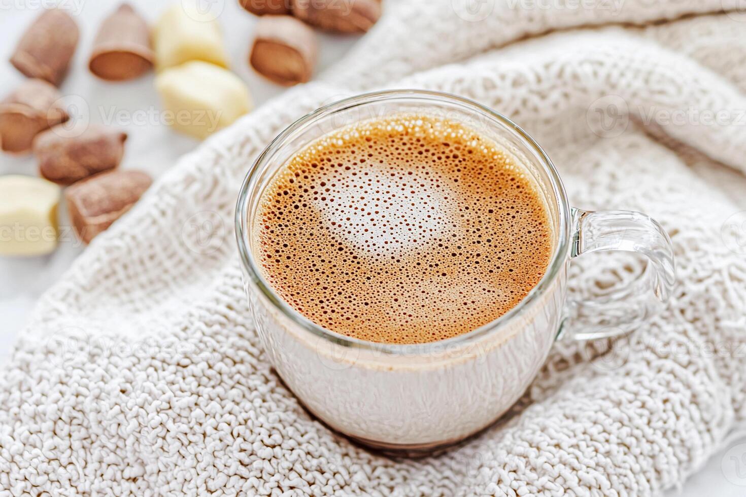 A glass of hot chocolate with chocolate chips photo