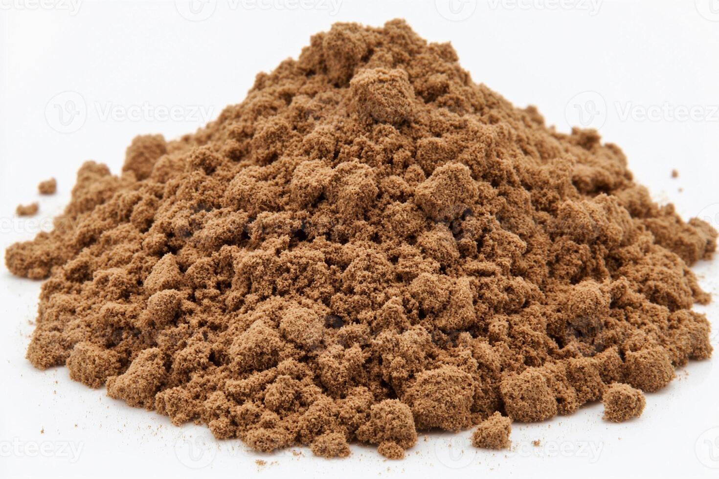 A pile of cocoa powder on a white background photo