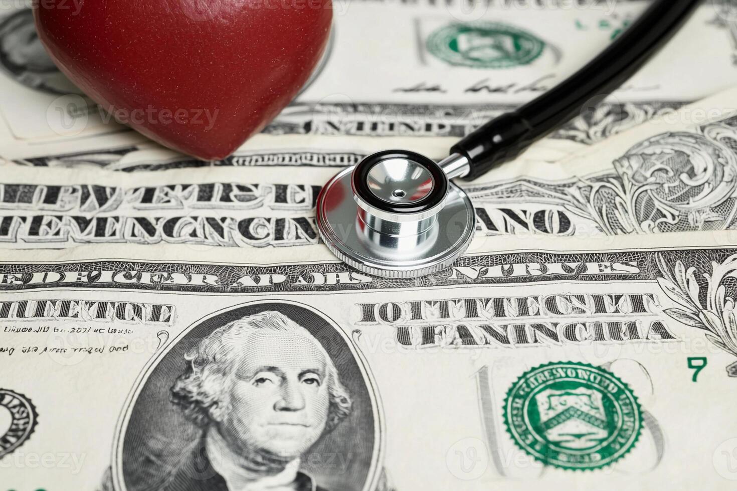 A stethoscope is placed on top of a heart on a pile of money photo