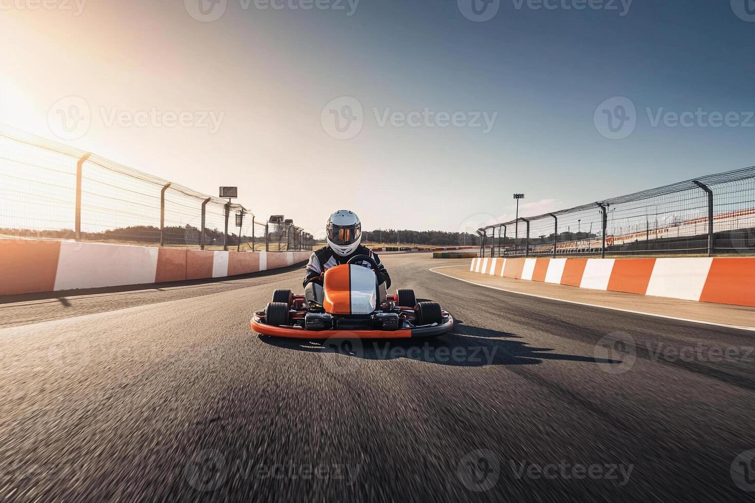 A person riding a go kart on a track photo