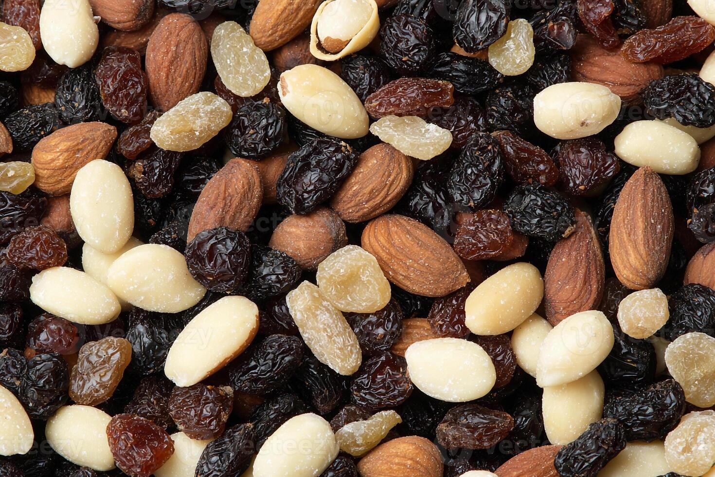 A close up of a pile of mixed nuts and raisins photo